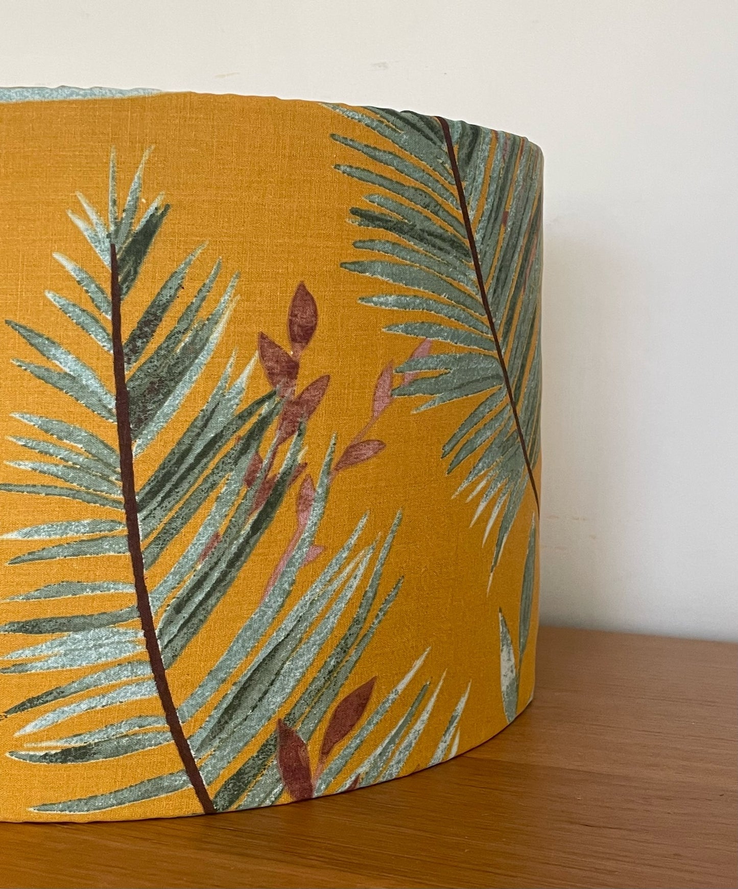 Mustard-yellow-lampsahde-with-tropical-leaves-drum-pendant