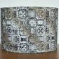 Textured lampshade with a pattern on a wooden surface