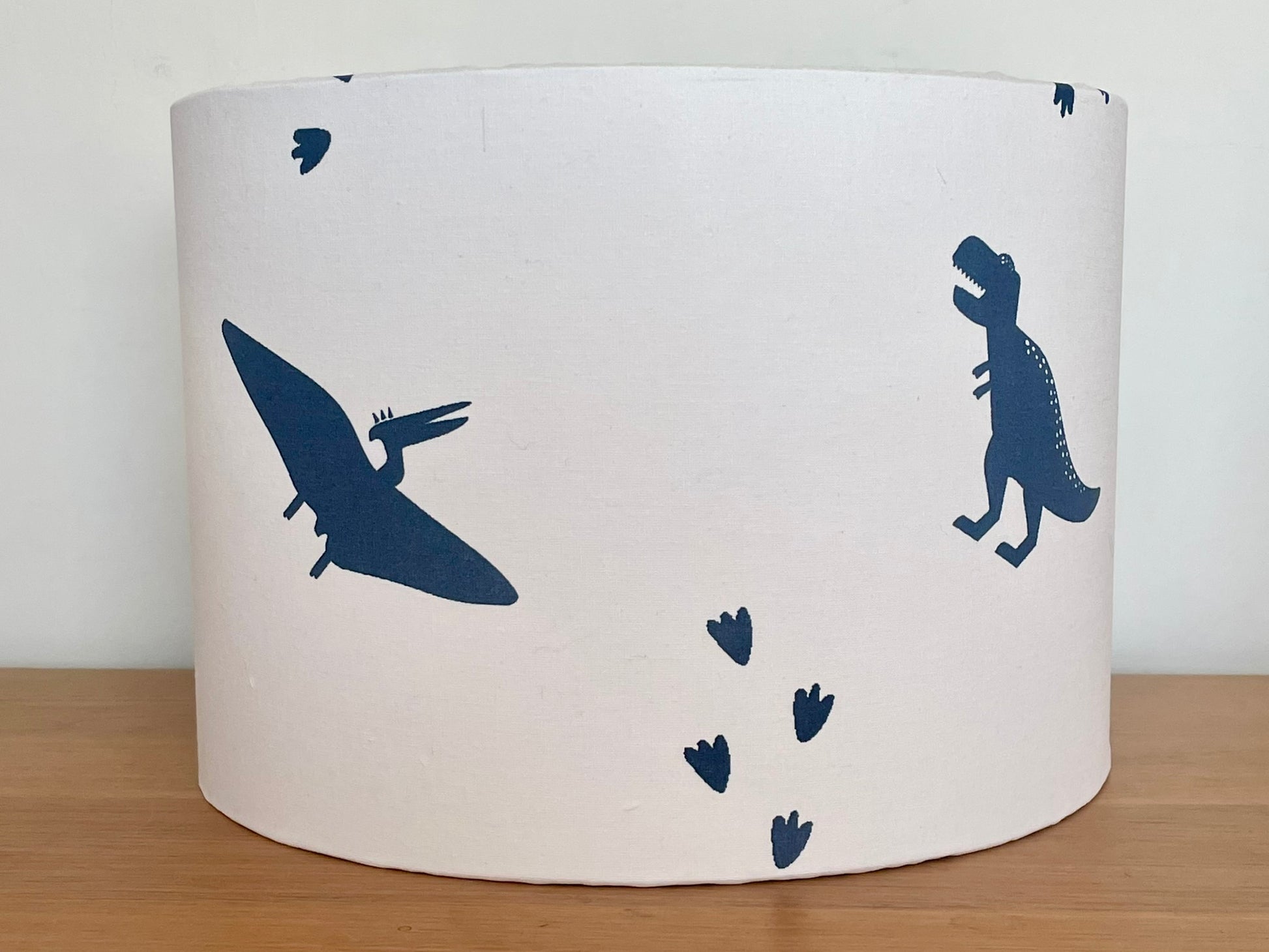 White rum lampshade with blue dinosaurs
