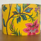 Decorative lampshade with floral pattern on a yellow background