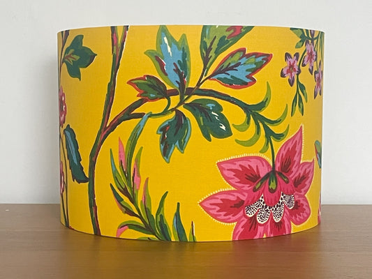 Decorative lampshade with floral pattern on a yellow background