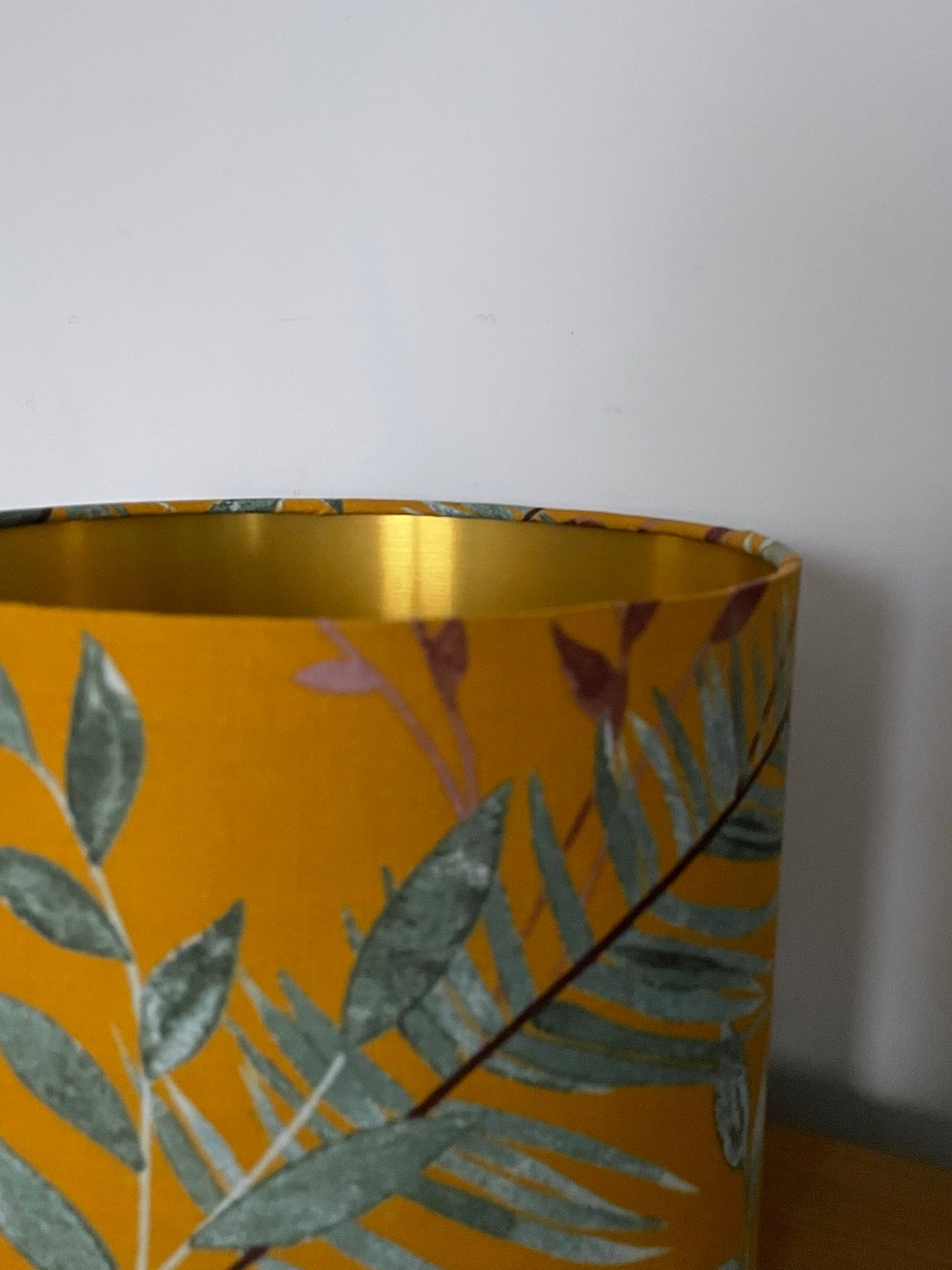 Mustard-yellow-lampsahde-with-tropical-leaves-botanical-boho