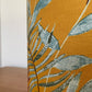    Mustard-yellow-lampsahde-with-tropical-leaves-table-light-shade