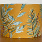 Mustard-yellow-lampsahde-with-tropical-leaves